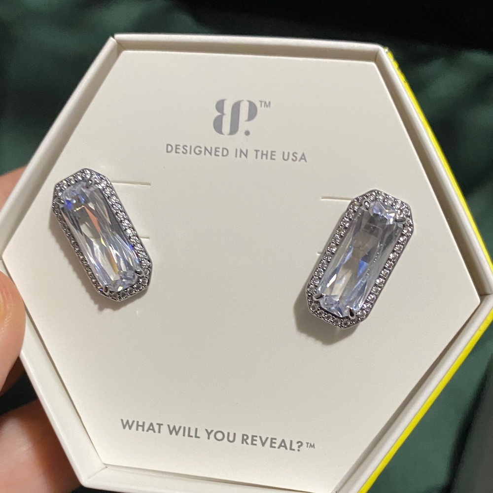 Cubic zirconia earrings on hematite